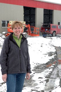 Expressions owner Kerri Van Hell looks over the Okotoks Business Park at what will become the new home of her business. Van Hell was the first to break ground in the business 