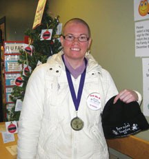Okotoks resident Kim Karran, pictured here after shaving her head to raise awareness for epilepsy last November, has suffered from the disorder for the past 11 years. She is
