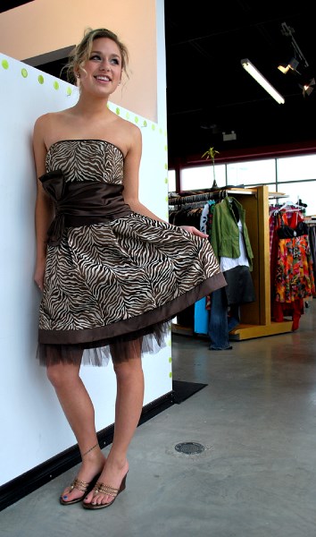 Hailey LeBlanc models the latest in prom fashions at Coco Rouge Boutique in Okotoks. Many young fashionistas are opting for short cocktail-style dresses instead of a