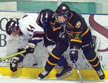 Bantam AA Oilers captain Taylor McNeill bodychecks a Cranbrook Ice player during a game in February. The Oilers lost to the Ice in the SCAHL championship final.