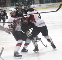 Oiler forward Kyle Reynolds is sandwiched by two Camrose Kodiaks defenceman during Okotoks&#8217; game seven loss at the Centennial Arena last Tuesday.