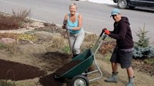 Drake Landing Solar Community residents Joane Grout, right, and Jennie Willings do some spring yardwork on Saturday afternoon. Grout helps host an annual block party held in
