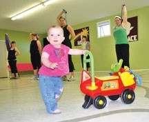 Alivia Keller, 12 months, exercises alongside her mom Tania in the Mommy and Me Exercise Program held in the Turner Valley United Church on May 10.