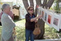 Potential buyers browse through the work at the Clothesline Festival and Art Sale at the Leighton Art Centre. This year&#8217;s event goes May 29 and will be preceded by the