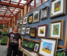 Artist Jan Walker-Roenisch poses with a collection of her work at the 2010 Cultivation of Art Sale. This year&#8217;s event features the work of 42 artists and goes Friday