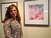 Pictured amongst works from a show tilted &#8220;A Passion for Petals&#8221; is Waterton artist Linda Anderson Stewart. The exhibition at Bluerock Gallery in Black Diamond is 