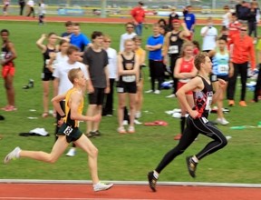 Okotoks runners, from left, Michael Quick and Alex Ivan, sprint to the finish line at the 800m youth boys final at the CALTAF Classic on June 12 in Calgary. Ivan was able to