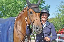 High River resident Lindsay Wendt accompanies her horse Chanel after a competition at the National tournament at Spruce Meadows. Wendt is competing with the most elite