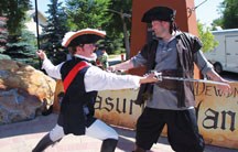 Paul Rancourt (left) and Jason Schneider (right) battle each other during a rehearsal of &#8220;Treasure Island&#8221; coming to Olde Towne Plaza this Friday. Outdoor