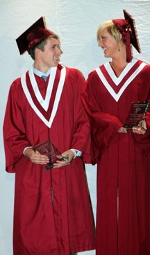 The Foothills Composite High School Grade 12 Athletes of the Year, Landon Pitcher and Paige Marzinzik, share a laugh after receiving their awards at the school&#8217;s