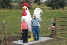 June and Owen Danforth check out Reggie the Rooster with their great-grandson Owen Varela after the eight-foot statue was put in place at the entrance to their foothills
