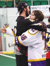 Whitby&#8217;s Mark Matthews, left, embraces Coquitlam&#8217;s Matthew Dinsdale after winning the Minto Cup on Aug. 28 at the Centennial Arena. Matthews won the championship