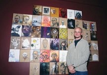 Calgary artist and cancer survivor Doug Driediger poses with the many self-portraits which comprise his exhibition opening Friday at the Okotoks Art Gallery. The works were
