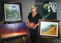 Okotoks artist Marg Smith poses with a collection of her artwork in advance of the Big Rock Artists and Guests sale October 21 and 22. She is not only an organizer of the
