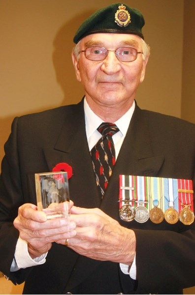 Ray Blackie displays one of the crystal soldiers he is selling to raise funds for Valour Place, the first medical facility for wounded soldiers to accommodate their families