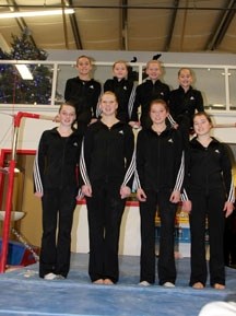 The Mountain Shadows Gymnastics Club in Okotoks is sending eight athletes to the Alberta Winter Games in February. They are on top of the bar, Jayda Newhook, Jenna Zeller,