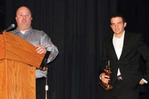 Okotoks Dawgs coach Brandon Newell presents the 2011 Dawgs Rookie of the Year Award to Tyler Hollick on Jan. 21 at the Foothills Centennial Centre. Hollick hit .407 for the