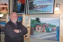 Artist Bill Dixon shows off a small part of his artwork collection he has produced over more than 70 years. He is holding an art sale at his Artworx Gallery every Sunday