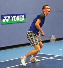 Edison Badminton Club player John Chernoff gets his racket set to hit the birdie during a practice session at the Edison School badminton facility. Chernoff, an Okotoks