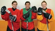 The three representatives from the foothills in female hockey at the Alberta Winter Games pose after a training session with the Zone 2 team. They are from left to right: