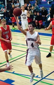 Jamie Derochie lays in two of his 16 points against the Raymond Comets on Feb. 4 at the Sir Winston Churchill Bulldogs tournament in Calgary.