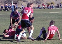 Okotokian Ryan Hassler (10) heads up field for the Celtic Barbarians in a rugby sevens tournament in Las Vegas in February. Fellow Okotokian, Peter Hillman (12), prepares to