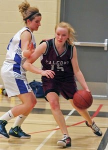 Foothills Falcon Amy Wooldridge dribbles by Highwood Mustang Molly Baldwin during Foothills Athletic Council playoff action. The Falcons finished tied for 11th at the 4A