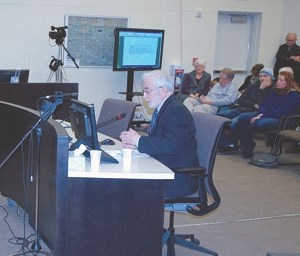 Dr. James Beck, University of Calgary medical biophysics professor, addresses town council during a March 26 public hearing about the future of fluoride in town water.