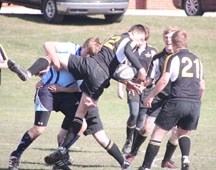 Oilfields Driller Ben Thorkelson is dumped by a Strathcona-Tweedsmuir Spartan on May 10 in Black Diamond. The Spartans won the rugby game 28-19 and improved to 3-1 in the Big 