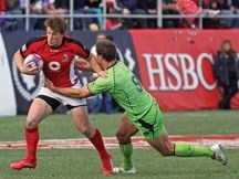 Jeff Hassler breaks through a tackle during Canada&#8217;s win over Australia in the bowl final of the Las Vegas stop on the IRB Sevens World Series