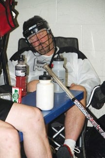 Okotoks Brad Banister takes a catnap during a break in a 24-hour lacrosse game in Calgary Saturday. Several members of the Senior Raiders and a couple of Okotokians played in 