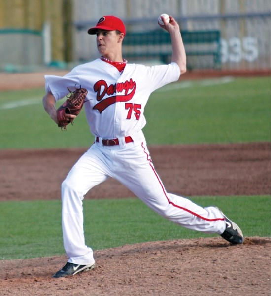 Okotoks Red Dawgs starting hurler Nick Vickers delivers a pitch during the sixth inning of the Dawgs&#8217; 2-1 win over the Okanagan A&#8217;s in the Tier II championship