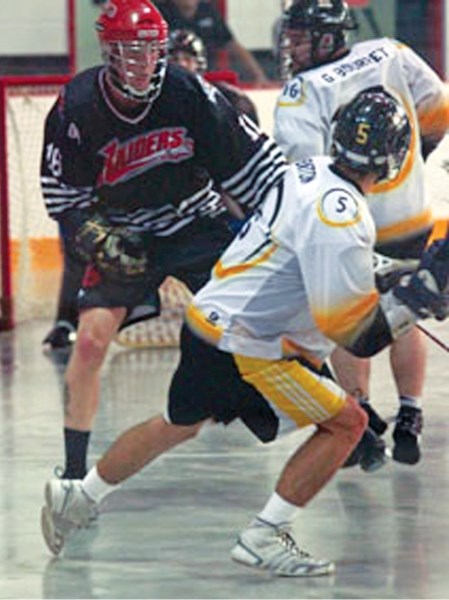 Okotoks native Cam Copland (18), seen here defending Edmonton Eclipse member Carson Barton, is one of the veteran members of a youthful Okotoks Junior A Raiders team in 2012.