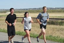 Holy Trinity Academy students Jacob Bryson, Janelle Ozimko and Zach Vent Erve head down Burnco Road en route to High River for the 10th annual Friendship Run on May 12.