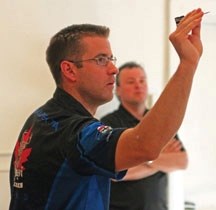 Okotokian Joel Turcotte figures out his placement before firing a dart during the National Dart Championships, May 26 at the Okotoks Elks Hall No. 31.