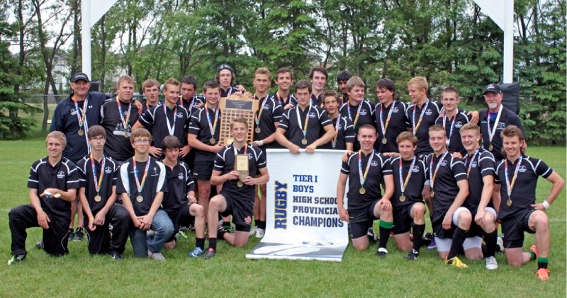 The Holy Trinity Academy Knights pose after winning their first Tier 1 provincial rugby championship, June 9 in Edmonton.