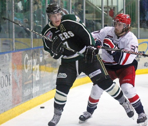 Okotoks Oiler Rhett Holland, seen here fighting for position with Brooks Bandit Taylor Elliott, was selected 102nd overall by the Phoenix Coyotes at the 2012 NHL Entry Draft