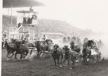 High River area chuckwagon driver Lloyd Nelson, left, wagon H, tries to chase down Bill Greenwood at the Calgary Stampede. The photo was taken in the late 1950s or early