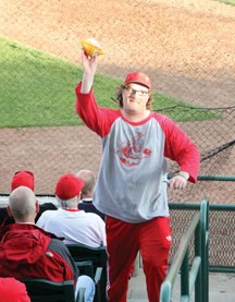 Darcy &#8220;The Hawker&#8221; Fairbourn sells one of his 1,488 bags of peanuts during an Okotoks Dawgs&#8217; June 30 game at Seaman Stadium. It is an unofficial record, but 