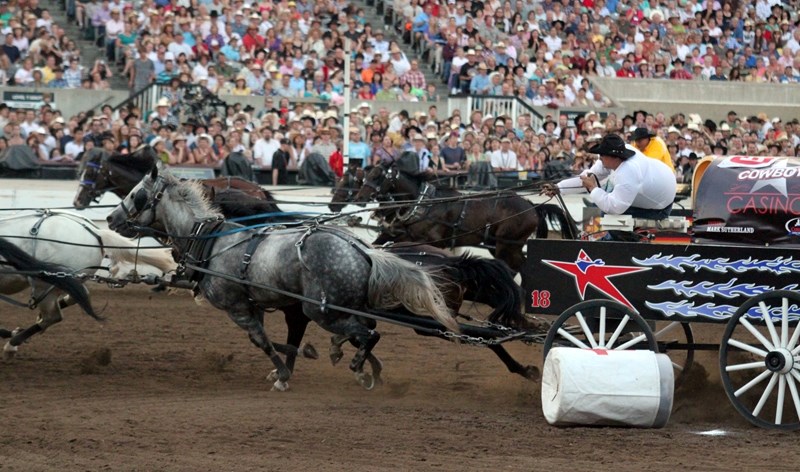 Okotoks chuckwagon driver Mark Sutherland hits the bottom barrel at the Calgary Stampede&#8217;s Rangeland Derby on July 8. Sutherland hit both barrels in the race and will