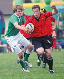A Foothills U15 Lion rushes the ball past a Calgary Saracen during the Lions&#8217; Festival of Rugby in June. The Lions will face their toughest test to date when