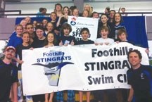 The Foothills Stingrays Swim Club pose after winning the Medium Team banner at the Alberta Age Group and Senior Championships, July 8 in Edmonton.