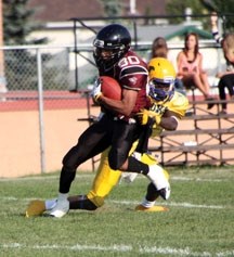 Foothills Falcon Rory Forrester heads up field after making a catch the Falcons&#8217; 33-13 victory over the Brooks Buffalos on Aug. 31 in Okotoks.