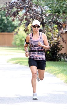 Andrea Siqueira has the right gear and the positive attitude for the Sheep River Road Race on Labour Day at Foothills Composite High School. She runs with an Iphone and a
