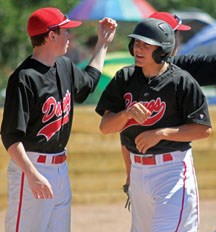Okotoks Bantam Dawg Austin Ely, on the right being congratulated at the provincials in Okotoks, was named the team&#8217;s MVP and a tournament all-star at the Bantam