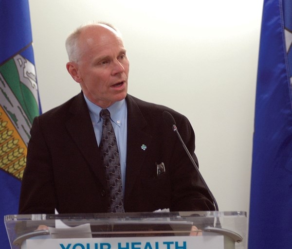 Alberta Health Services board chairman Stephen Lockwood speaks during the opening of the Calgary South Health Campus on Sept. 6 with health minister Fred Horne in the