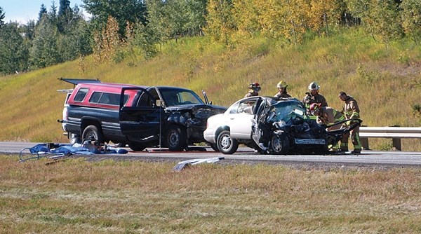 The 70-year-old driver of the white sedan died at the scene of this crash near Priddis.