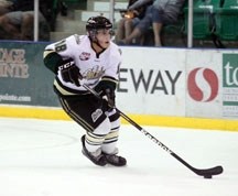 Max Mowat controls the puck during his debut with the Okotoks Oilers on Sept. 14.