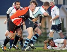 Foothills Lions player/coach Darcy Gallant wraps up a Calgary Canuck during the 2012 Calgary Rugby Union season.
