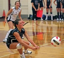 Foothills Falcon Jackie Leaney dives to make a dig during the Falcons&#8217; season opening loss to the Strathmore Spartans on Sept. 11.